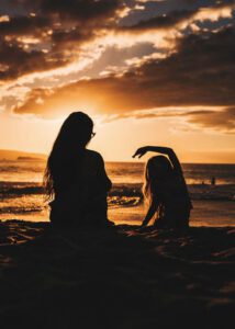 mother and daughter at sunset