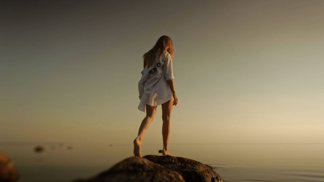 girl alone walking on rocks