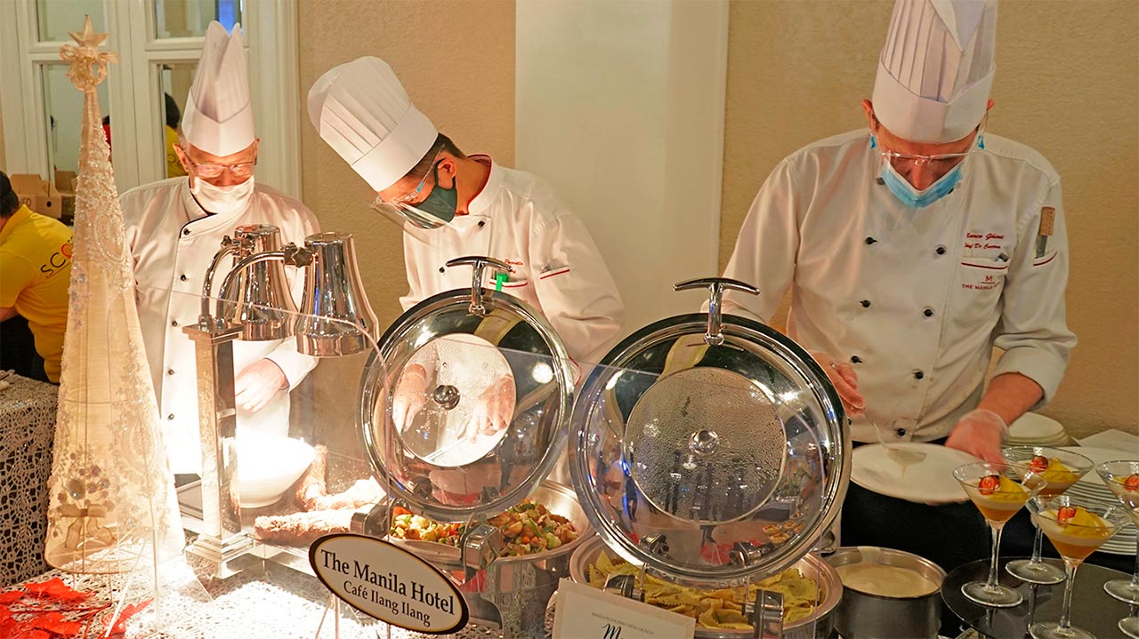Cafe Ilang Ilang chefs led by Executive Chef Konrad Walter (left) preparing the dishes showcased at the Manila Resturant Week launch held in Roma Salon at The Manila Hotel